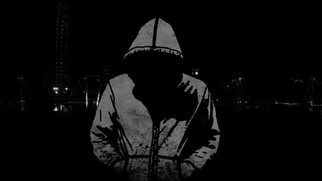 Shadowed Cyber Enigma: Unidentified Hacker in Hooded Jacket Amidst Futuristic Cityscape - Full HD Background Image Wallpaper