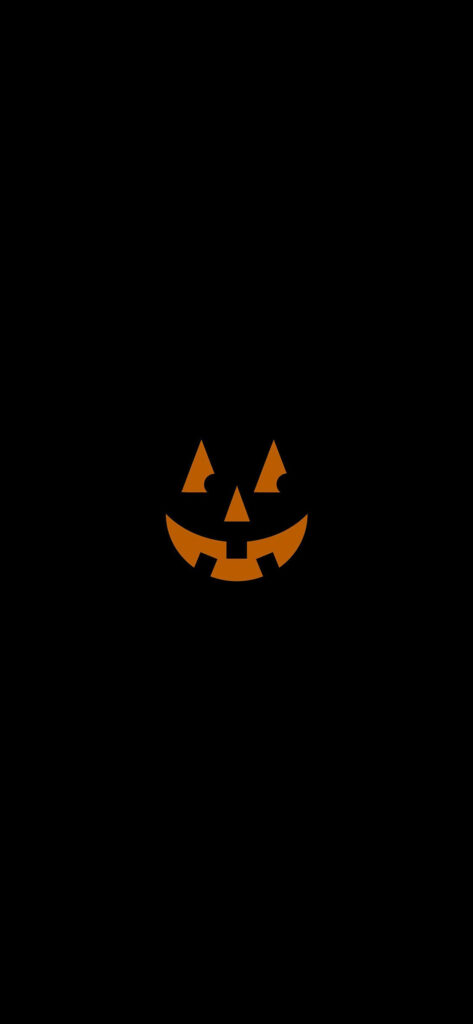 Sinister Grins: Halloween iPhone Wallpaper Boasts a Menacing Pumpkin on Gothic Black Background