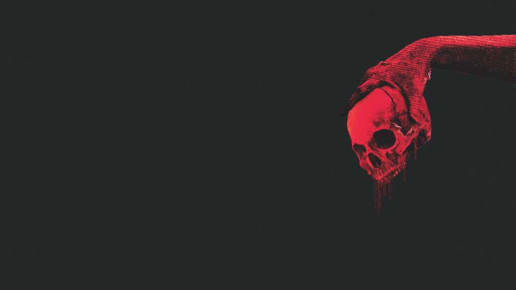 The Menacing Red Skull: A Terrifying Encounter in the Shadows Wallpaper