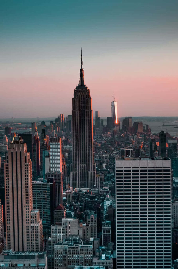 In the Heart of Power: The Towering State Empire in Bustling New York City Wallpaper