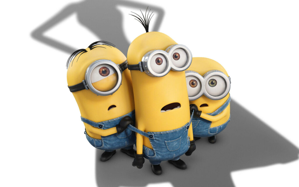 Terrified Trio: Adorable Minions Confront Supernatural Shadows Wallpaper