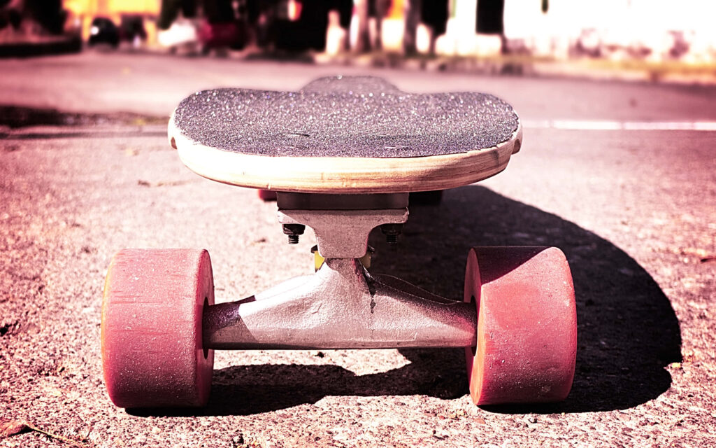 Cruising in Style: Retro Skateboard Adventure on the Open Road Wallpaper