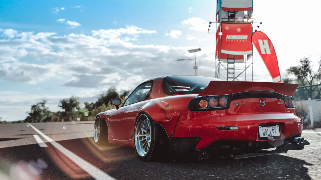 The Speed Demon: Unleashing the Power and Precision of the Mazda RX-7 on the Race Circuit Wallpaper