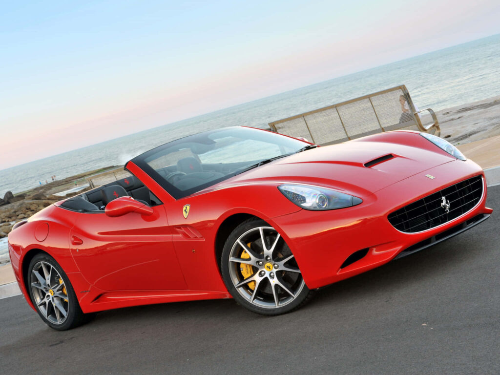 The Epitome of Automotive Excellence: Uniting Power and Luxury in this Ferrari Masterpiece Wallpaper