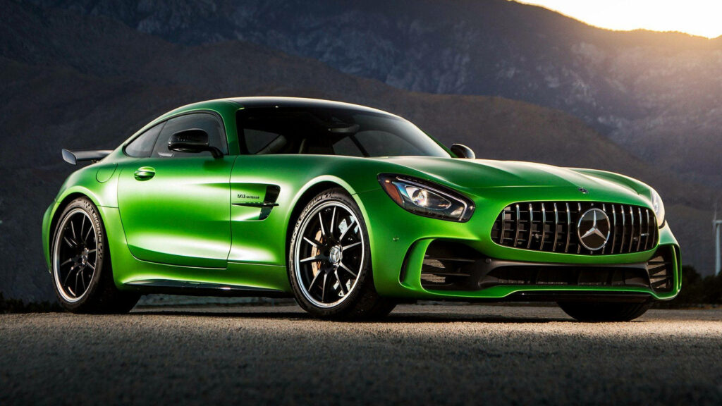 Unleash the Beast: High-Class Bright Green Mercedes AMG GTR Shines Against Sunrise Shadowy Hillside Wallpaper
