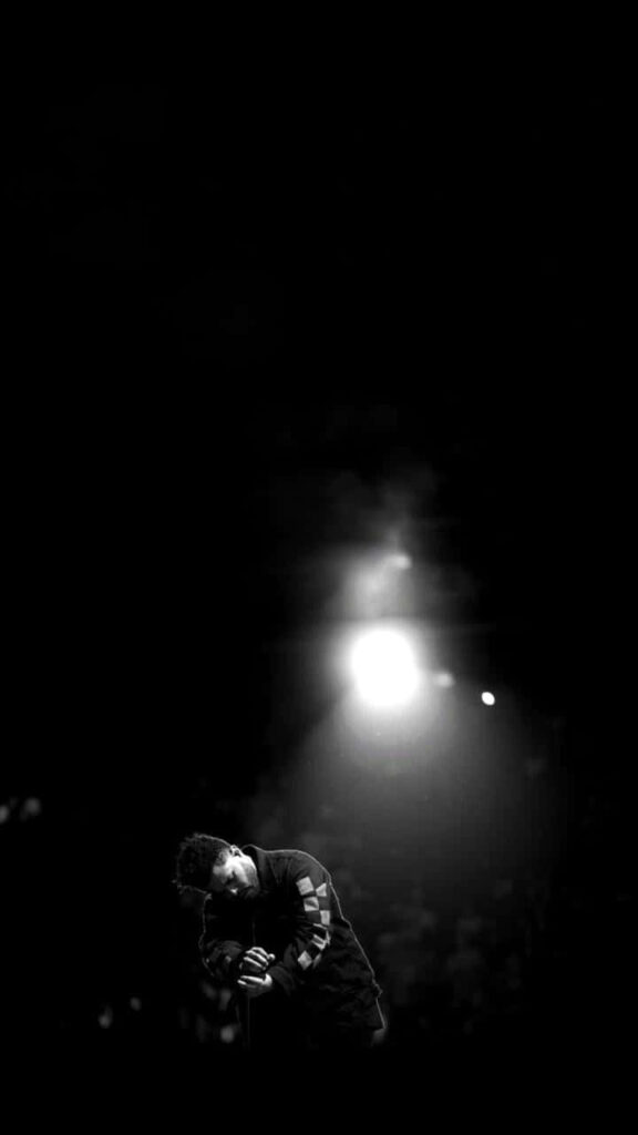Captivating The Weeknd Wallpaper: Dramatic Stage Presence & Spotlight