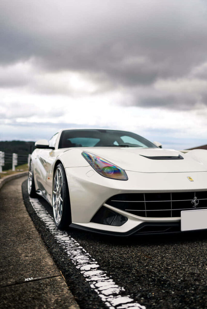 Luxurious Fusion: Uniting Elegance and Performance in the White Ferrari iPhone Wallpaper