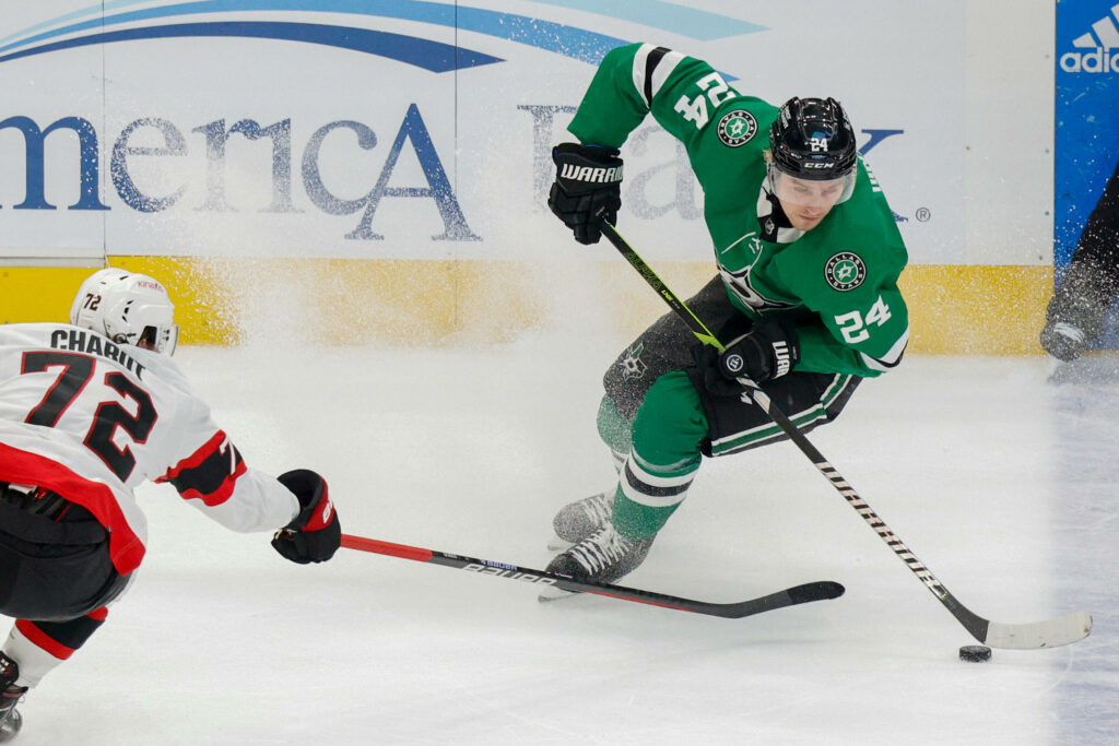 Thomas Chabot Defends Against Dallas Stars - Hockey Wallpaper