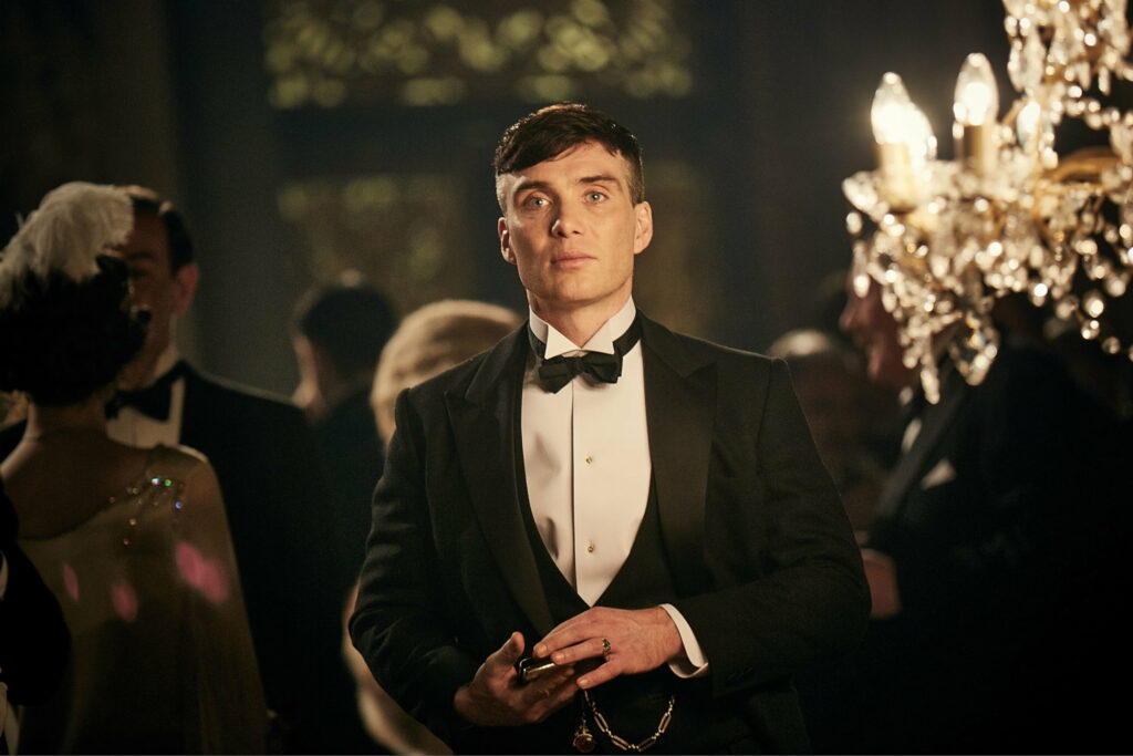 Stylish wallpaper featuring Cillian Murphy as Thomas Shelby from Peaky Blinders in luxurious setting