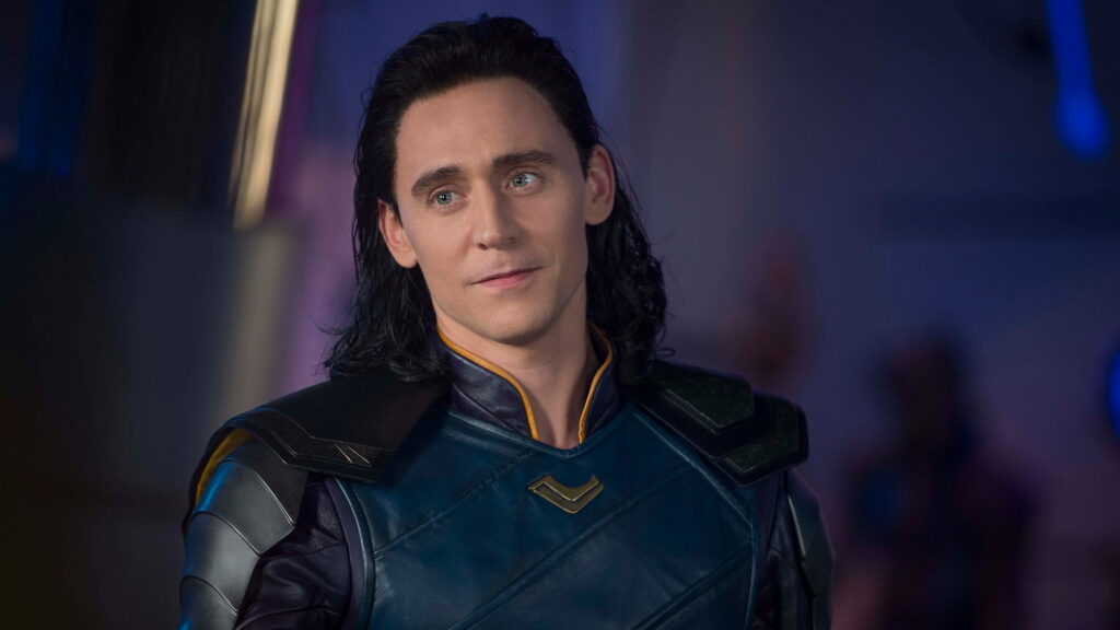 Tom Hiddleston as Loki in dark blue armor QHD Marvel wallpaper with moody elegant character art