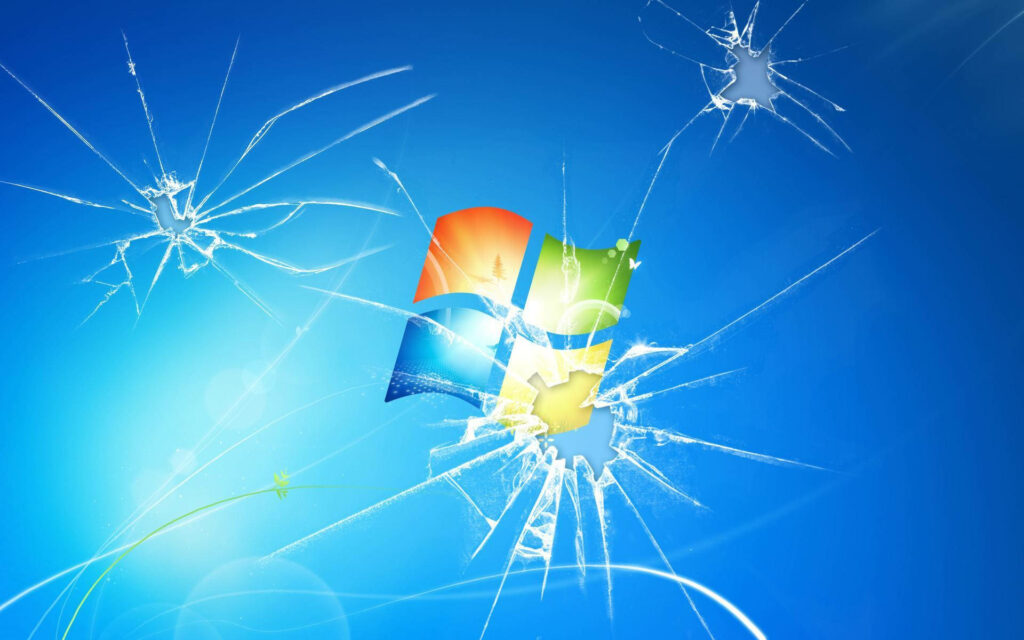 Triple Trouble: A Cracked Computer Screen Wallpaper with Three Cracks for Windows 7 Background
