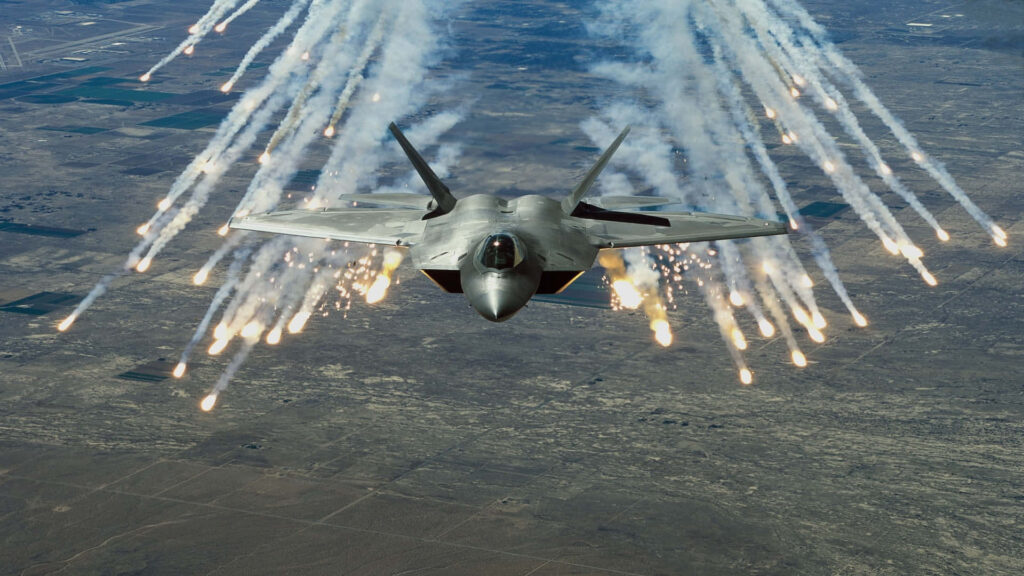 Airborne Combat between Lockheed Martin F-22 Raptors and Air Missiles Wallpaper