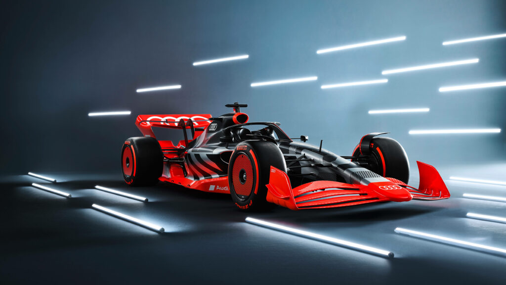 Thrilling F1 Race: A High-Speed Journey amidst Enthusiastic Spectators in a Vibrant Stadium Wallpaper