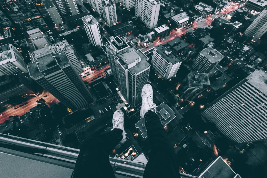 Thrilling Cityscape Aerial View: Rooftop Adventure Wallpaper