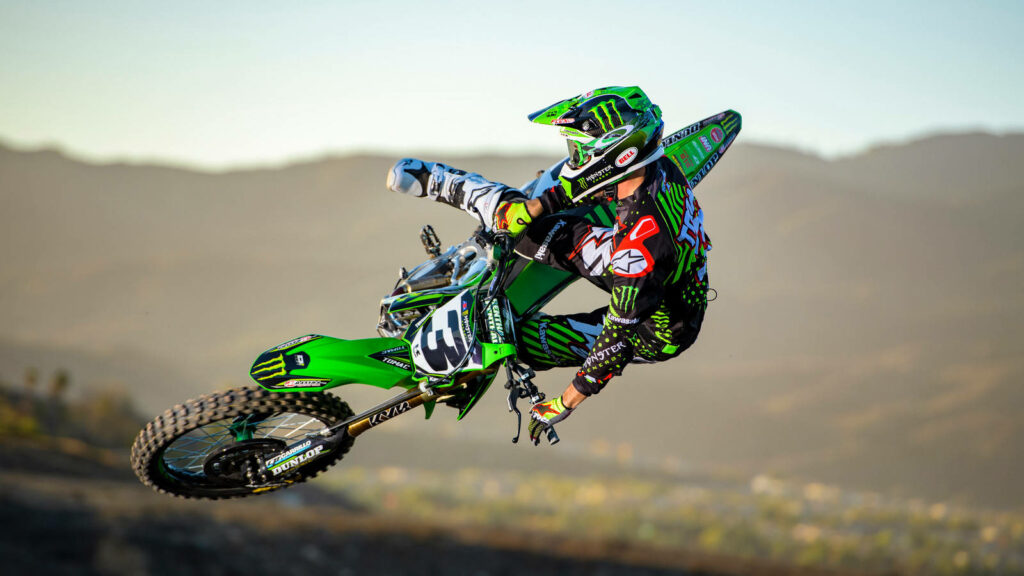 Thrilling Dirt Bike Rider Stunt - High-Energy Wallpaper Background