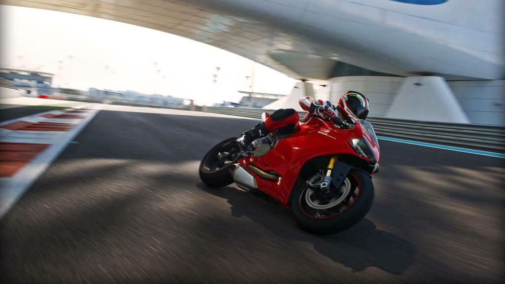 Thrilling Ducati Motorcycle Wallpaper: Speed & Precision on Racetrack