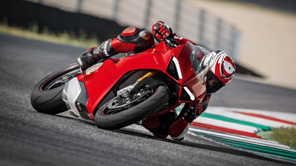 Thrilling Ducati Racer: Dynamic Red Motorcycle Wallpaper Background