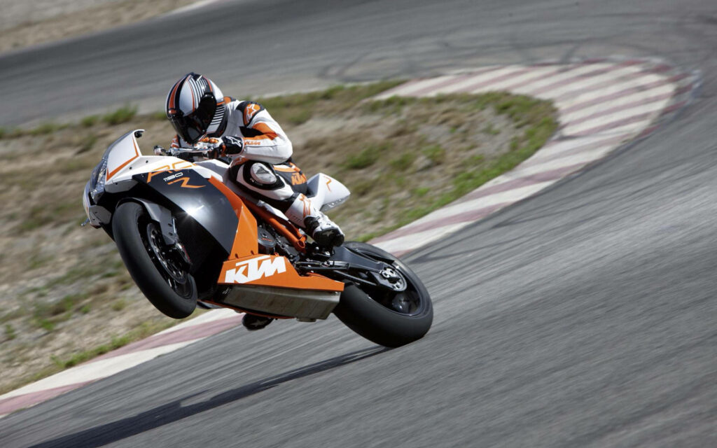 Dynamic KTM Bike Jump Wallpaper: Speed & Adventure in Motorsports