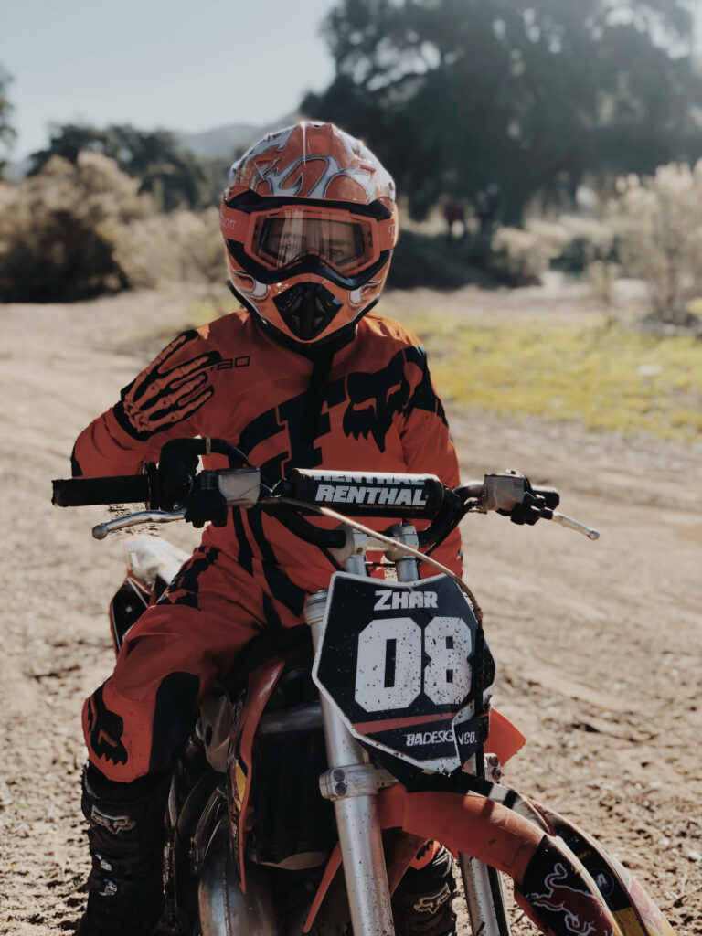 Thrilling Motocross Wallpaper: KTM Rider in Action on Dirt Track