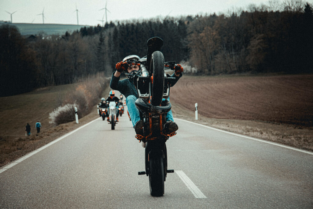 Thrilling Motocross Wallpaper: Adrenaline-Fueled KTM Riders in Nature