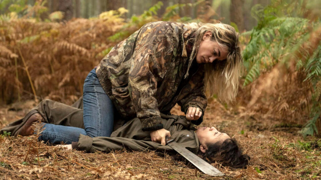 Intense Killing Eve Forest Confrontation - Dramatic Wallpaper Background