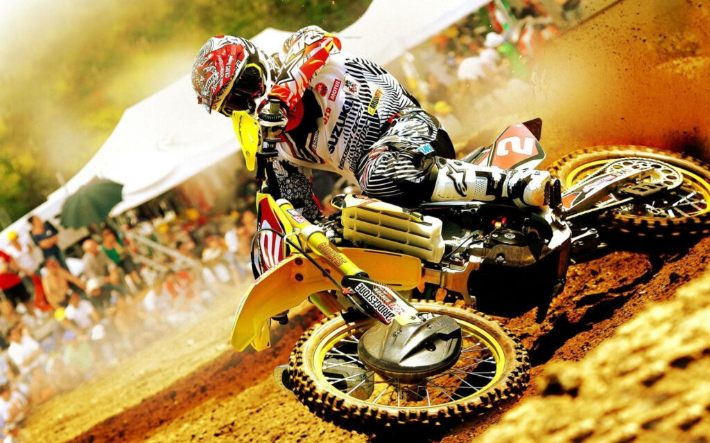 Exciting Motocross Wallpaper: Suzuki Rider on Dirt Track Action