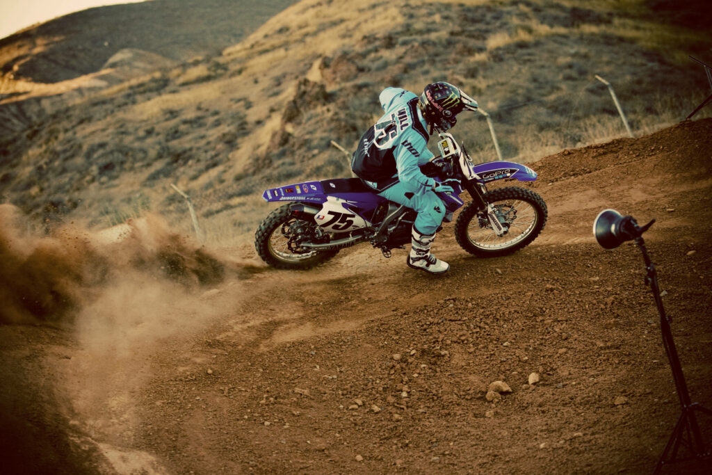 Dynamic Motocross Rider HD Wallpaper in Rugged Mountain Landscape