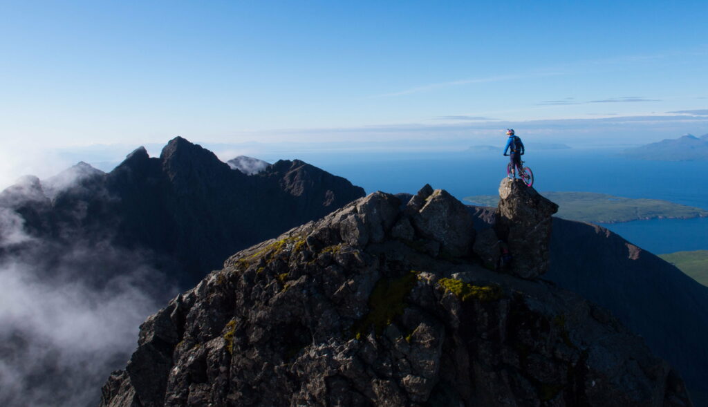 Mountain Biking Escape: Thrilling Adventure in Majestic Peaks - 4K Wallpaper