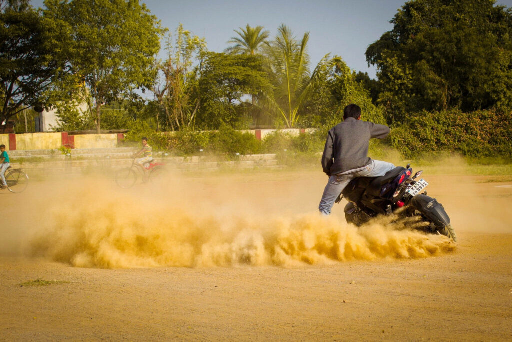 Thrilling NS 200 Pulsar Drift Wallpaper in Dusty Sunny Field