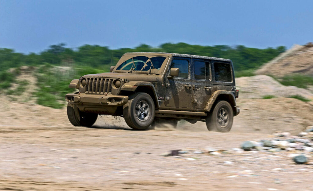 Dynamic Off-Road Jeep Wallpaper: Rugged Adventure Background