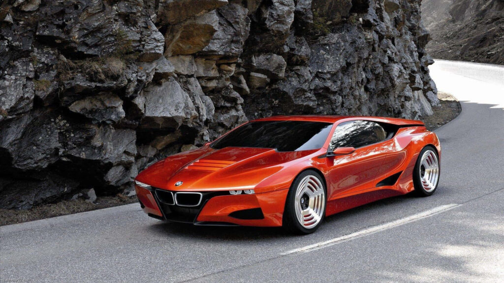 Roaring in Style: A Stunning Orange BMW M1 Hommage Dominates the Curvy Road Wallpaper
