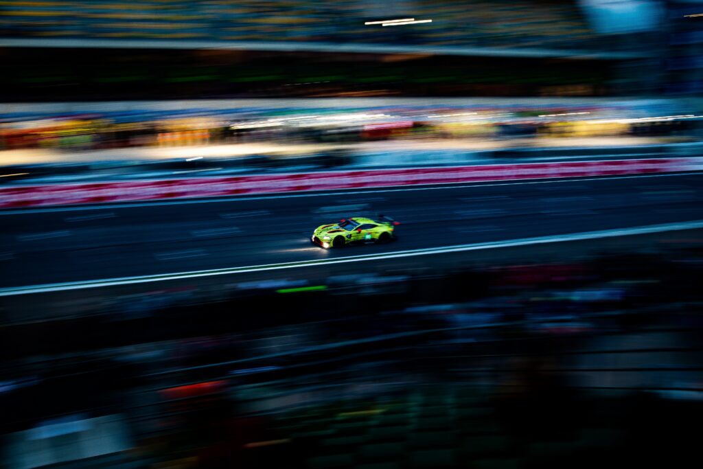 Dynamic Wallpaper of a Speeding Sports Car on Track - Thrilling Background
