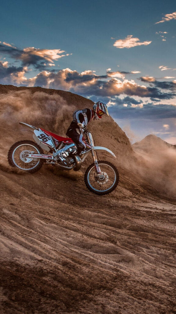 Thrilling Enduro Motocross Wallpaper: Adventurous Rider in Action