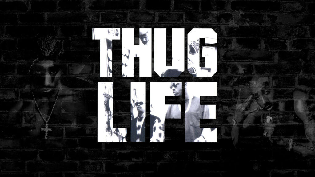 Legendary Tupac Shakur Embracing the 'Thug Life' in Contemporary Desktop Wallpaper