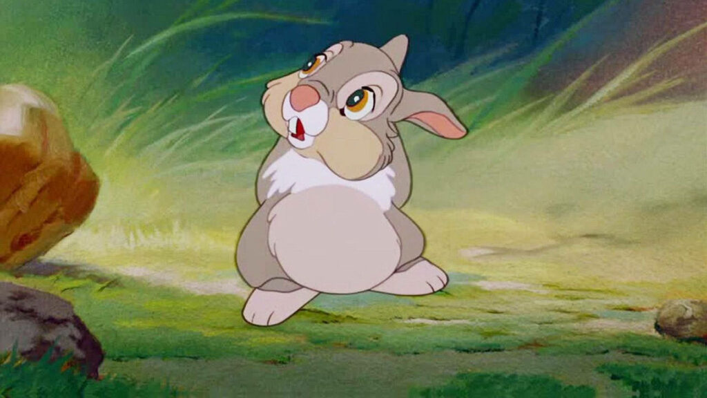 Thumper, the Lovable Bunny from Disney's Bambi, Strikes a Chubby Pose on the Vibrant Green Lawn Wallpaper