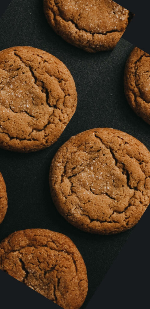 Brown Cookies on a sleek black canvas Wallpaper