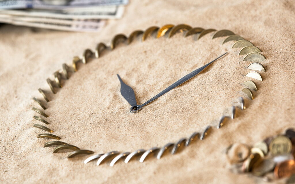 Tick-Tock Economics: Time's Value Captured in Clock's Embrace - QHD Wallpaper Background