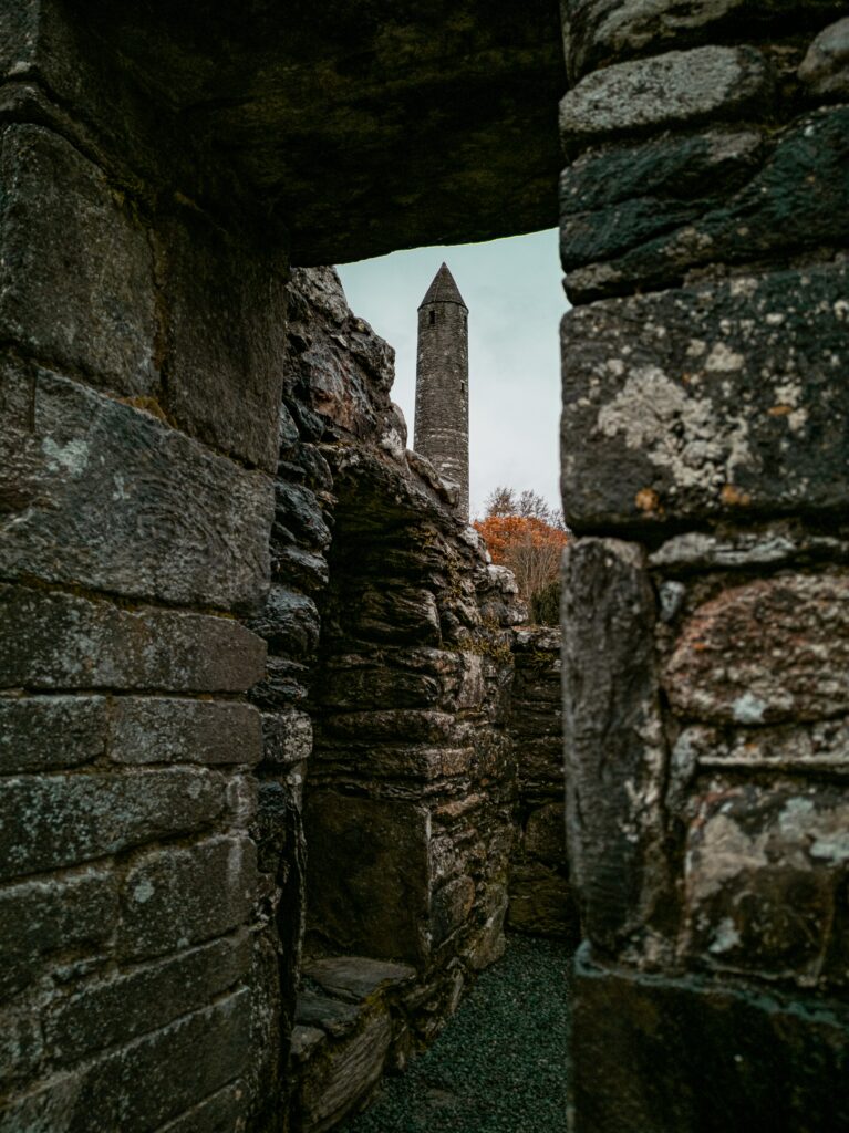 Weathered Stone Ruins & Tower: Timeless Ancient Architecture Wallpaper