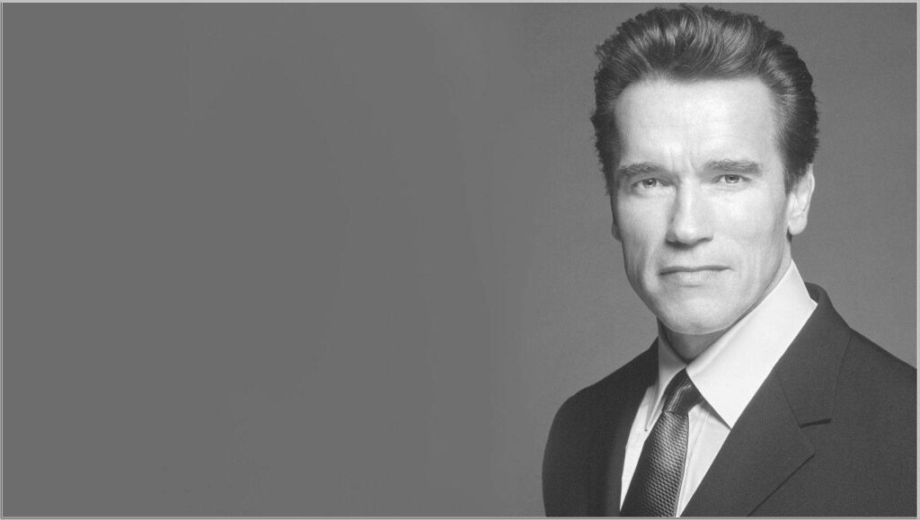 Timeless Arnold Schwarzenegger Wallpaper in Formal Attire