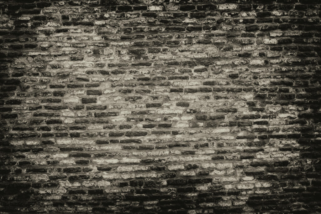 Timeless Charm: Old Brick Wallpaper in Classic White and Black Concrete Texture - a captivating background photo.