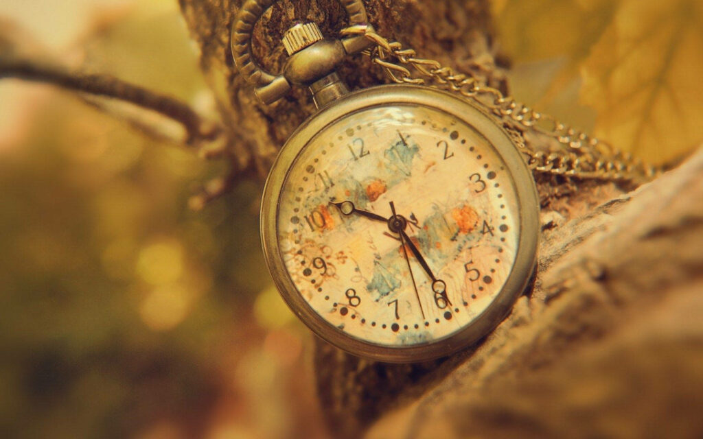 Timeless Elegance: Vintage inspired laptop background with an antique pocket watch Wallpaper