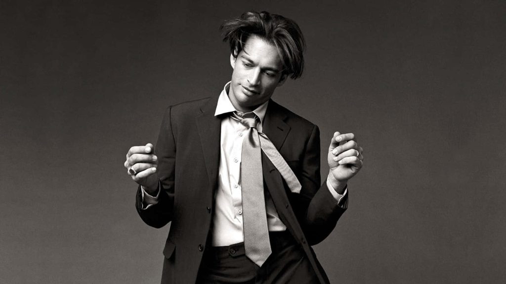 Harry Connick Jr young portrait black and white sharp suit undone tie moody lighting wallpaper