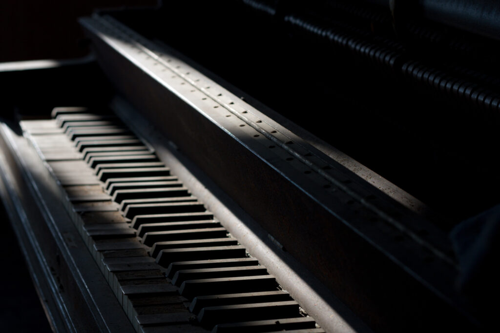 Timeless Piano Wallpaper: Nostalgic Beauty in Soft Lighting