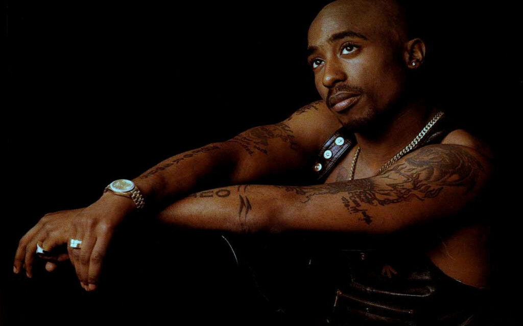 The Introspective Icon: 2Pac Contemplating Time Wallpaper