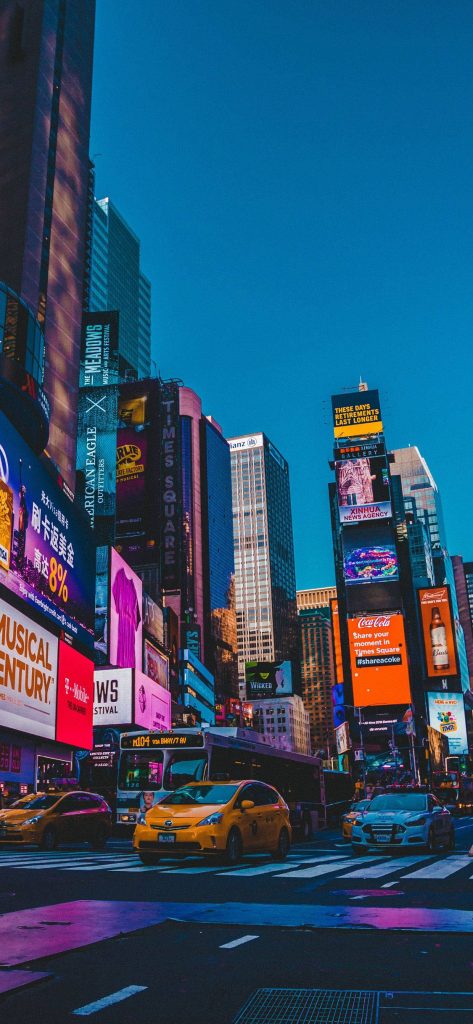 Times Square LED signs wallpaper NYC twilight Coca-Cola American Eagle vibrant cityscape