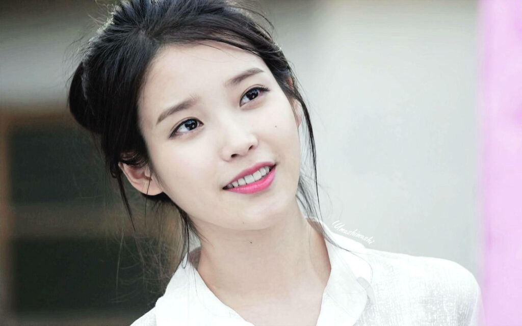 IU's Radiant Beauty Shines in Tied Hair Wallpaper