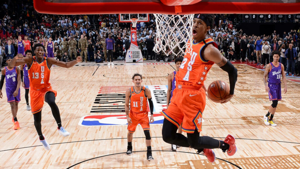 Soaring to New Heights: Ja Morant's Epic Dunk in the Rising Stars Challenge Wallpaper