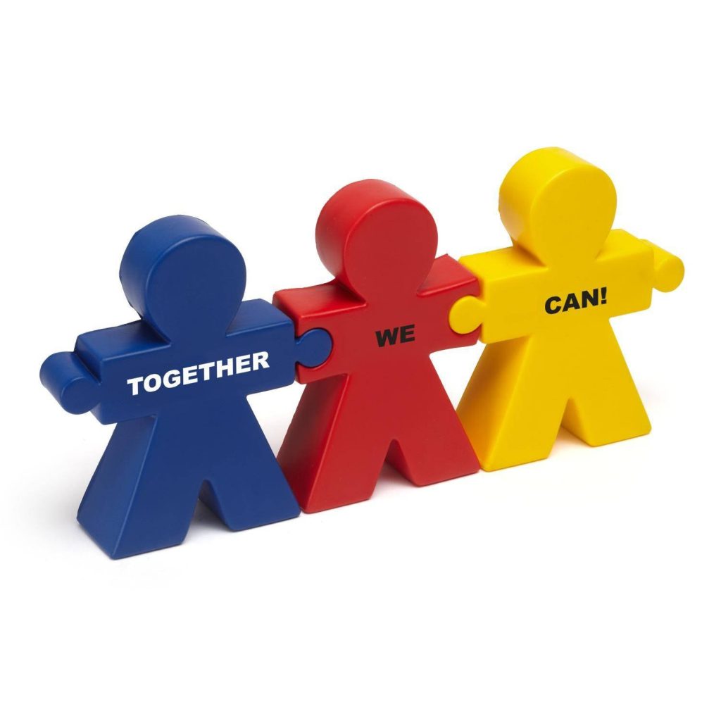 Three colorful human puzzle pieces with Together We Can text symbolizing teamwork unity wallpaper