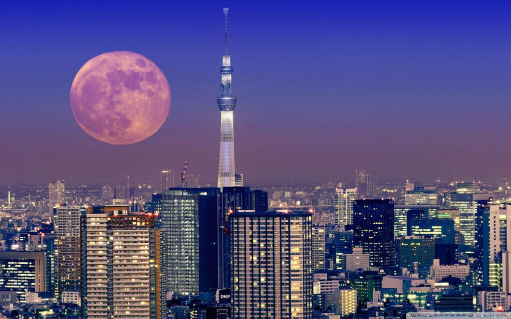 Tokyo Tower Serenade: Mesmerizing Cityscape with Illuminated Pink Moon - Enchanting Computer Wallpaper