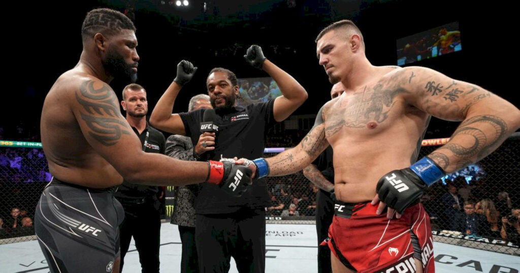 Tom Aspinall and Curtis Blaydes intense UFC 304 faceoff with focused expressions fight night wallpaper
